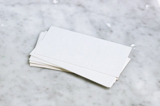 A stack of white paper sitting on top of a counter